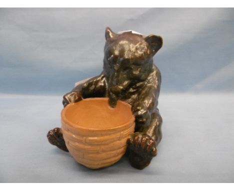 A Doulton Lambeth bear with honey pot possible modeled by Mark Marshall, chip to ear