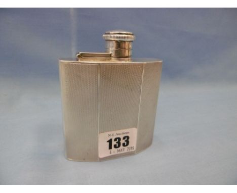 An art deco engine turned hallmarked silver hip flask with hinged cover, height total 10cms width 8 cms, weighs 146 grams sil