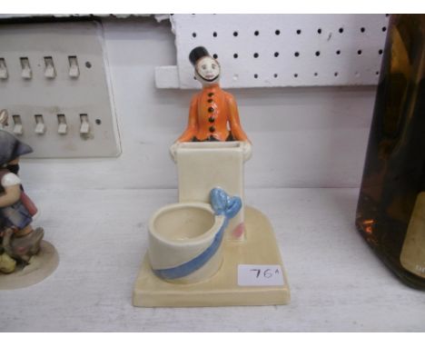An art deco 1930's ceramic bellboy match holder signed Ivan Goldovitich