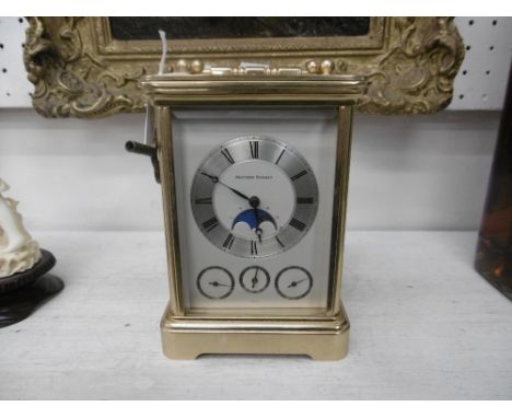 A Matthew Norman, moon face grand opera repeater carriage clock, working but some damage