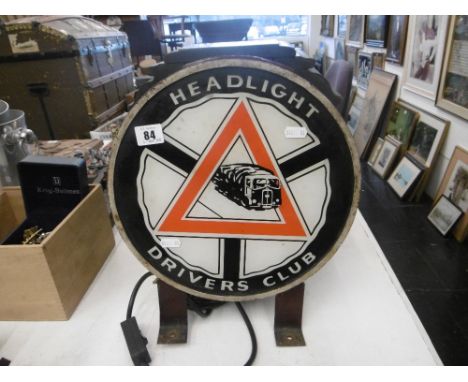 A headlight drivers club display light
