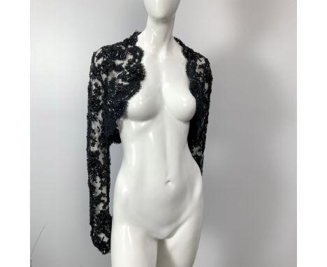 A lovely vintage delicately crafted black lace long sleeved bolero adorned with beads and sequins. Size: 4. Bust: 18"W. Back 