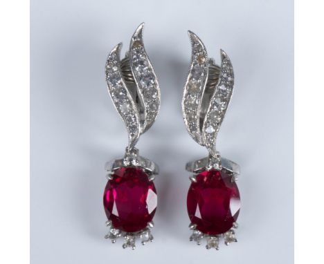 Elegant earring design of cushion ruby gemstone accented with zircons on leaf design. Clip on clasp. Sterling impressed mark.