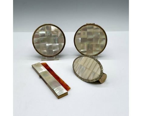 Lot includes 2 round Max Factor compacts; mirrored lipstick case; and comb. Largest piece: 0.50"H x 3" dia. Issued: 20th cent