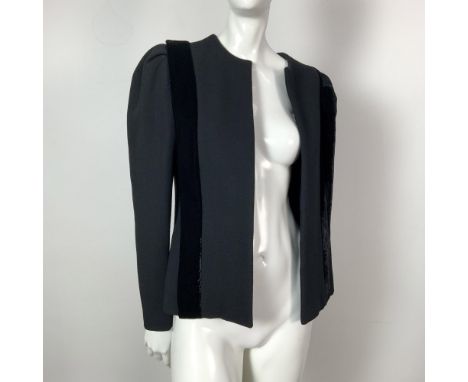 An elegant vintage jacket crafted from black wool and silk, featuring two bold velvet stripes running down the front. Size: 8
