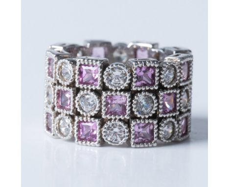 Features a three stack with incrusted ruby gemstones and sparkly rhinestones. Marked 925 NH. Total weight: 14gIssued: 20th ce