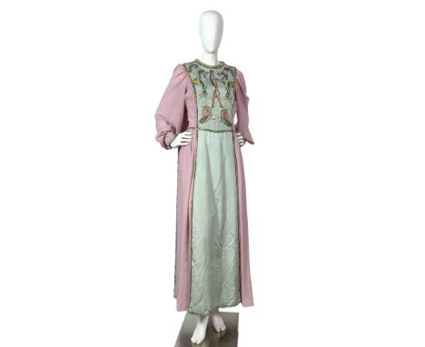 A vintage long-sleeved dress in pale pink and sage green, featuring exquisite hand-embroidered designs of various animals and
