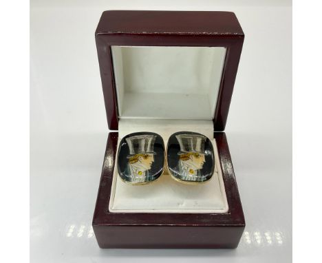 These clasp style cuff links are hand painted and enameled with a gentleman in top hat motif. Marked to back, made in France.