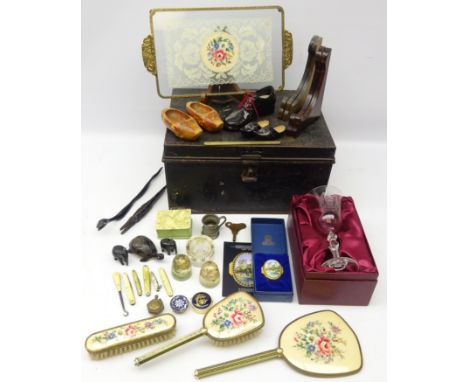 Black japanned tin deed box containing collector's items including gilt metal and embroidered dressing table set, trench art 