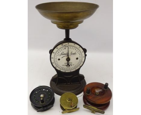 Cast iron 'Family Scale' with enamelled circular dial to weigh 10Kg and removable brass bowl together with three fishing reel