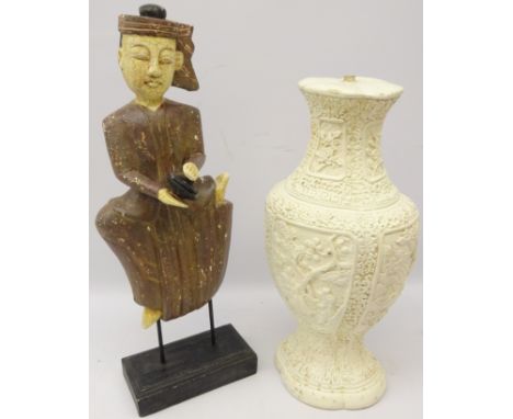 Oriental carved and painted figure of a musician on ebonised stand, H51cm and a Chinese painted table lamp decorated in relie