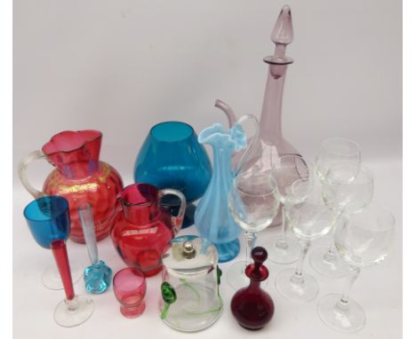 Eleven pieces of coloured glassware including Art Nouveau honey pot with plated lid, two cranberry glass jugs, amethyst glass