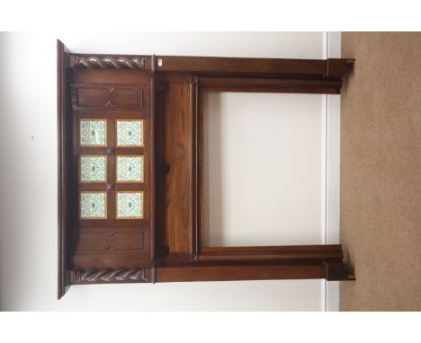 Early 20th century oak fire surround, projecting cornice, barley twist columns flanking floral patterned tiles, W154cm, H187c
