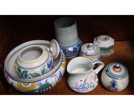 A collection of Poole pottery, includes bowls, lidded conserve jars