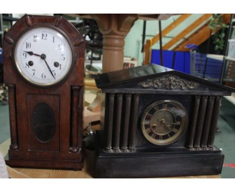 A late Victorian black slate mantel clock of architectural design, together with one other mantel clock