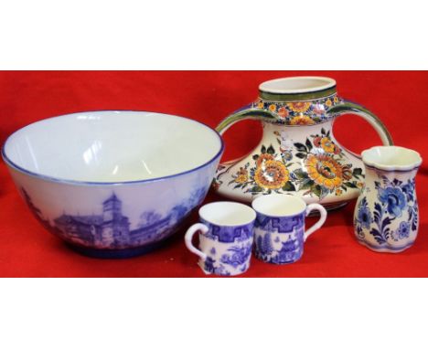 A group of&nbsp; blue and white ceramics to include a large flow blue bowl. two Royal Worcester coffee cans, and two Delft va