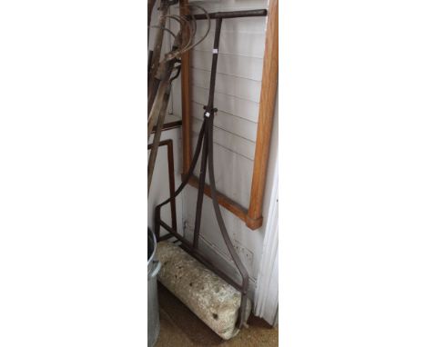 A metal framed, stone garden roller