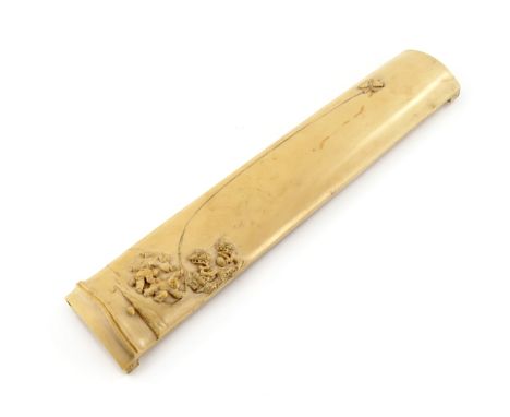 λ A CHINESE IVORY WRIST REST 19TH CENTURY Formed as a tapering section of bamboo, the concave side carved in relief with figu