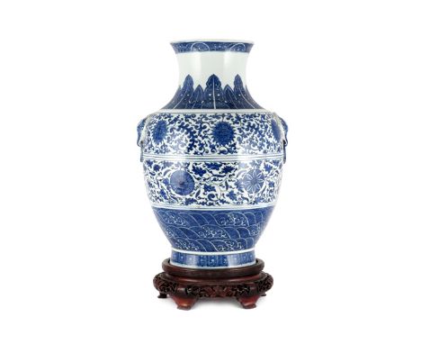 A LARGE CHINESE BLUE AND WHITE VASE 19TH/20TH CENTURY The ovoid body painted with concentric bands depicting crashing waves, 