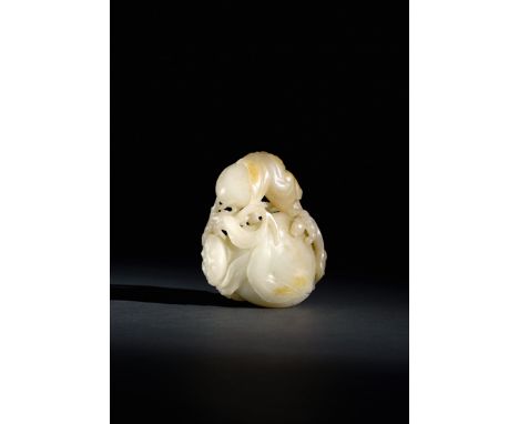 A FINE CHINESE PALE CELADON JADE CARVING OF PEACHES QIANLONG 1736-95 The fruits issuing from a gnarled leafy stem, a lotus se