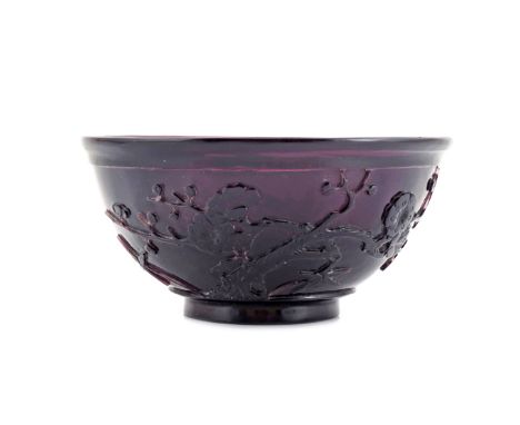 A CHINESE AMETHYST BEIJING GLASS BOWL 18TH CENTURY Carved to the exterior with two birds in flight with bamboo and prunus eme