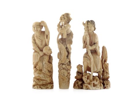 λ THREE JAPANESE IVORY OKIMONO MEIJI 1868-1912 Variously carved as Raijin being attacked by a small crab, as Gama Sennin flan