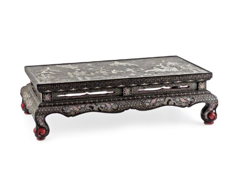 A CHINESE MOTHER OF PEARL INLAID BLACK LACQUER STAND MING DYNASTY The top decorated with a scene of figures meeting on a terr