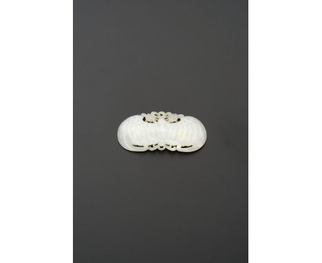 A CHINESE WHITE JADE PLAQUE 18TH/19TH CENTURY Carved as a bat, its wings outstretched, holding chrysanthemums tied with ribbo