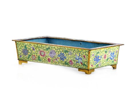 A CHINESE CANTON ENAMEL RECTANGULAR JARDINIERE 19TH/20TH CENTURY Raised on four gilt feet, decorated with scrolling foliage a