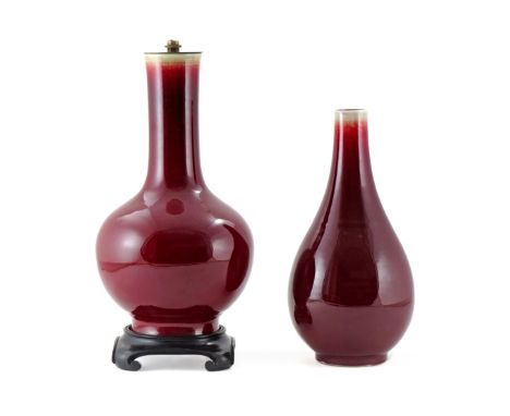 TWO CHINESE RED FLAMBE GLAZED VASES 19TH/20TH CENTURY One with a pear-shaped body, a six character Guangxu mark to the base, 