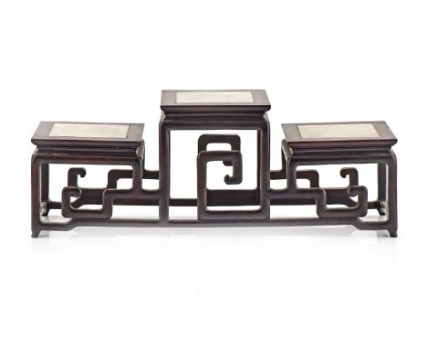A CHINESE HARDWOOD STAND 19TH/20TH CENTURY With three square tops, each inlaid with a marble panel and raised on legs joined 