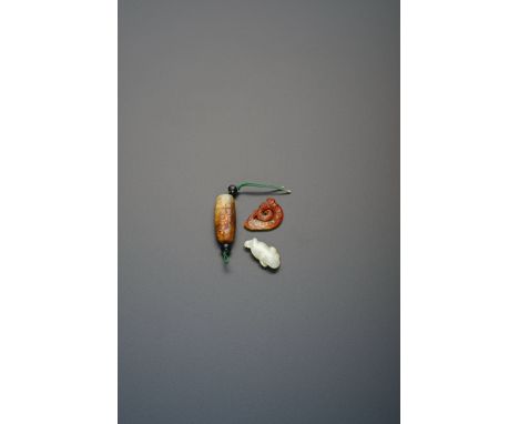 THREE SMALL CHINESE JADE CARVINGS QING DYNASTY OR EARLIER One formed as a three-legged toad, another a curled dragon, its bac