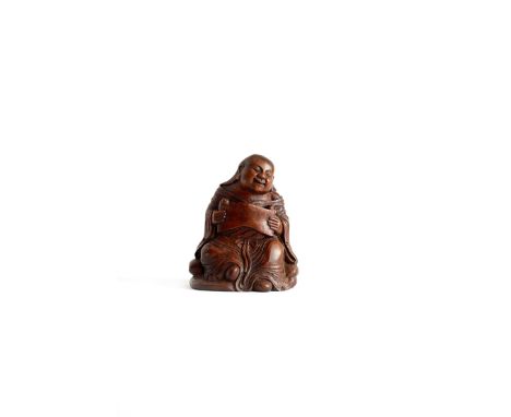 A CHINESE CARVED BAMBOO FIGURE OF LIU HAI 18TH CENTURY Seated with his robes drawn around him, a gourd secured at his waist, 