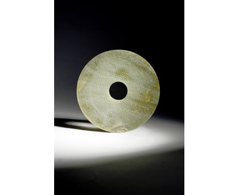 A LARGE AND RARE CHINESE IMPERIAL CELADON JADE DATED BI DISC INSCRIBED QIAN LONG JI YOU, CORRESPONDING TO THE YEAR 1789 In We