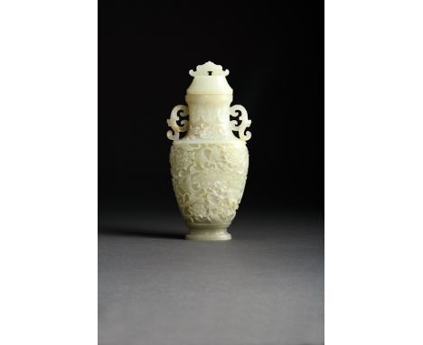 A CHINESE PALE CELADON JADE VASE AND COVER QING DYNASTY Carved in shallow relief with a continuous scrolling peony design, a 