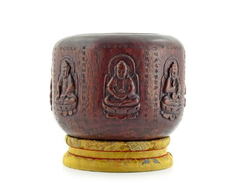 A CHINESE BAMBOO OVOID JAR PROBABLY LATE QING Carved in high relief with seven figures of Buddha, divided by and beneath band