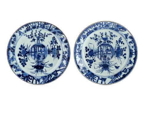 A PAIR OF CHINESE BLUE AND WHITE DISHES KANGXI 1662-1722 The centres and borders painted with small figures engaged in daily 