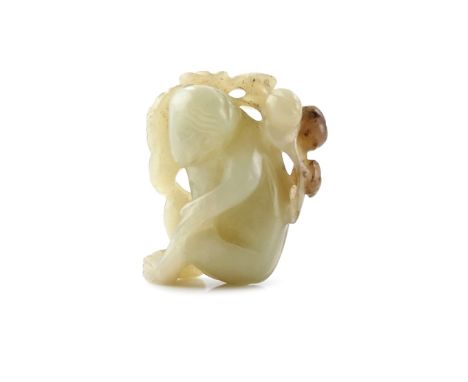 A SMALL CHINESE CELADON JADE CARVING OF A MONKEY 19TH CENTURY Crouching with his head turned to the left, a fruiting peach sp