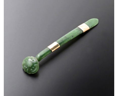 A CHINESE SPINACH-GREEN JADE HAIR ORNAMENT 18TH/19TH CENTURY Modelled as a ruyi-sceptre, the head carved in relief with C-scr