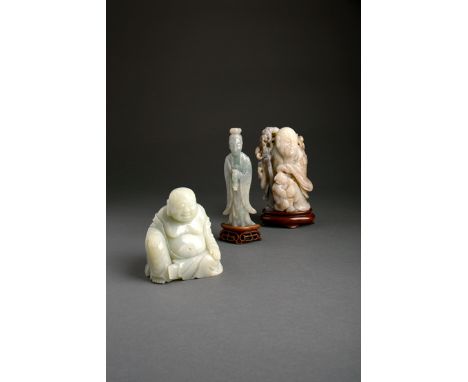 THREE CHINESE JADE FIGURES QING DYNASTY One jadeite, carved as Guanyin holding a small bottle, another as a seated Budai He S