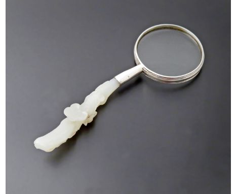 A CHINESE WHITE JADE BELTHOOK QING DYNASTY Forming the handle of a magnifying glass, 15.2cm. 