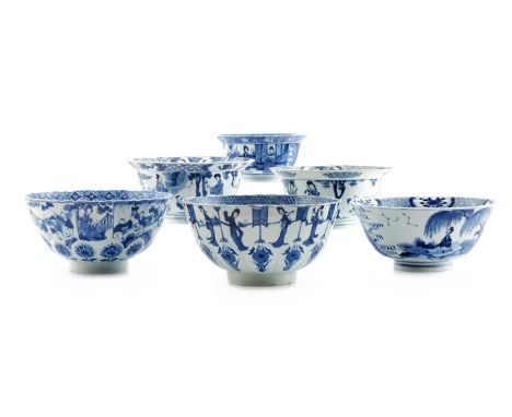 SIX CHINESE BLUE AND WHITE BOWLS KANGXI 1662-1722 Each painted with figural scenes, with foliate panels and geometric borders