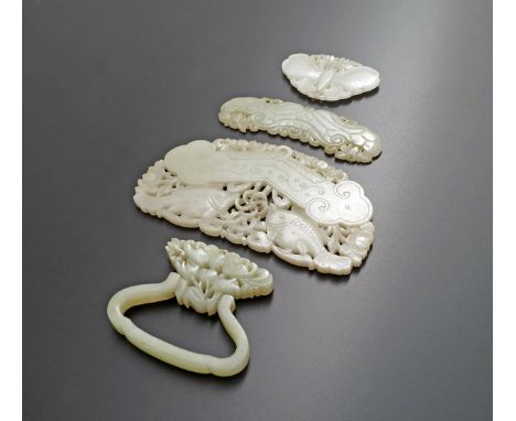 THREE CHINESE PALE CELADON JADE QING PLAQUES QING DYNASTY One carved as a butterfly, one a large lotus leaf, another of twin 