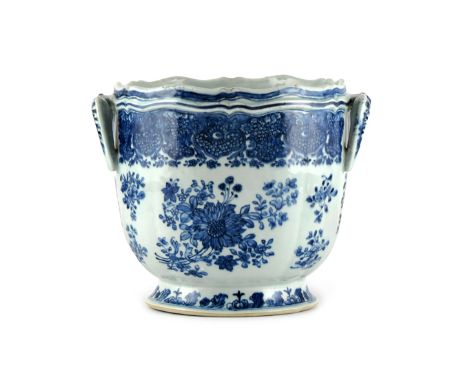 A CHINESE BLUE AND WHITE WINE COOLER 18TH CENTURY After a silver shape, painted with flower sprays beneath a band of Fitzhugh