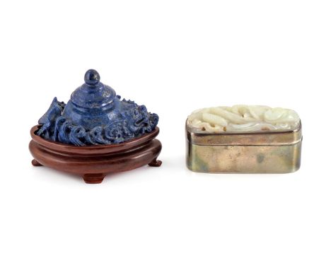 A SMALL CHINESE LAPIS LAZULI WATER POT AND COVER LATE QING DYNASTY Carved with a fish amidst waves, raised on a wood stand, a