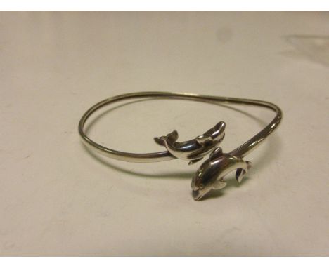 Hallmarked silver bangle with Dolphins