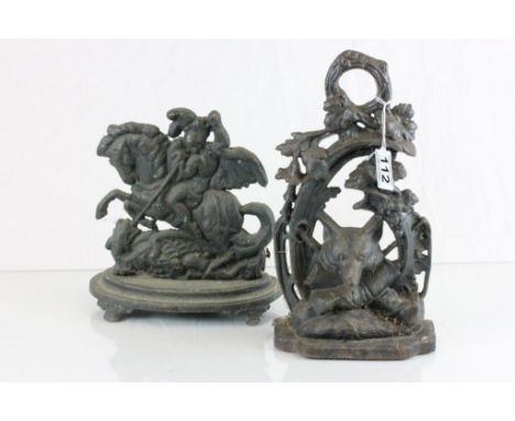 Two vintage cast iron door stops to include; George & Dragon and Hunting theme