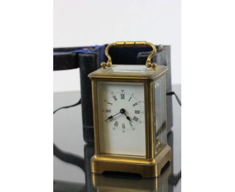 Key wind brass Carriage clock with enamel dial and leather outer case