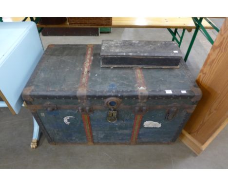 A steamer trunk and small box