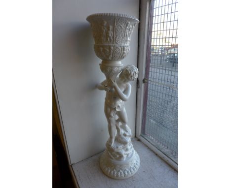 A 1960's Italian style ceramic figural jardiniere and stand